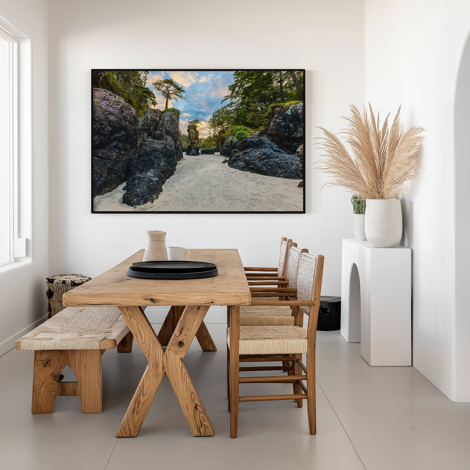 Between the Sea Stacks at San Josef Bay print shown on the wall in a dining room.