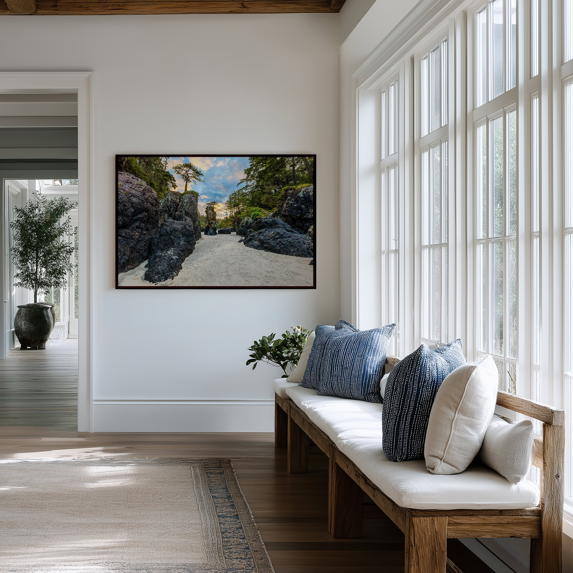 Between the Sea Stacks at San Josef Bay print shown on the wall in an entryway.