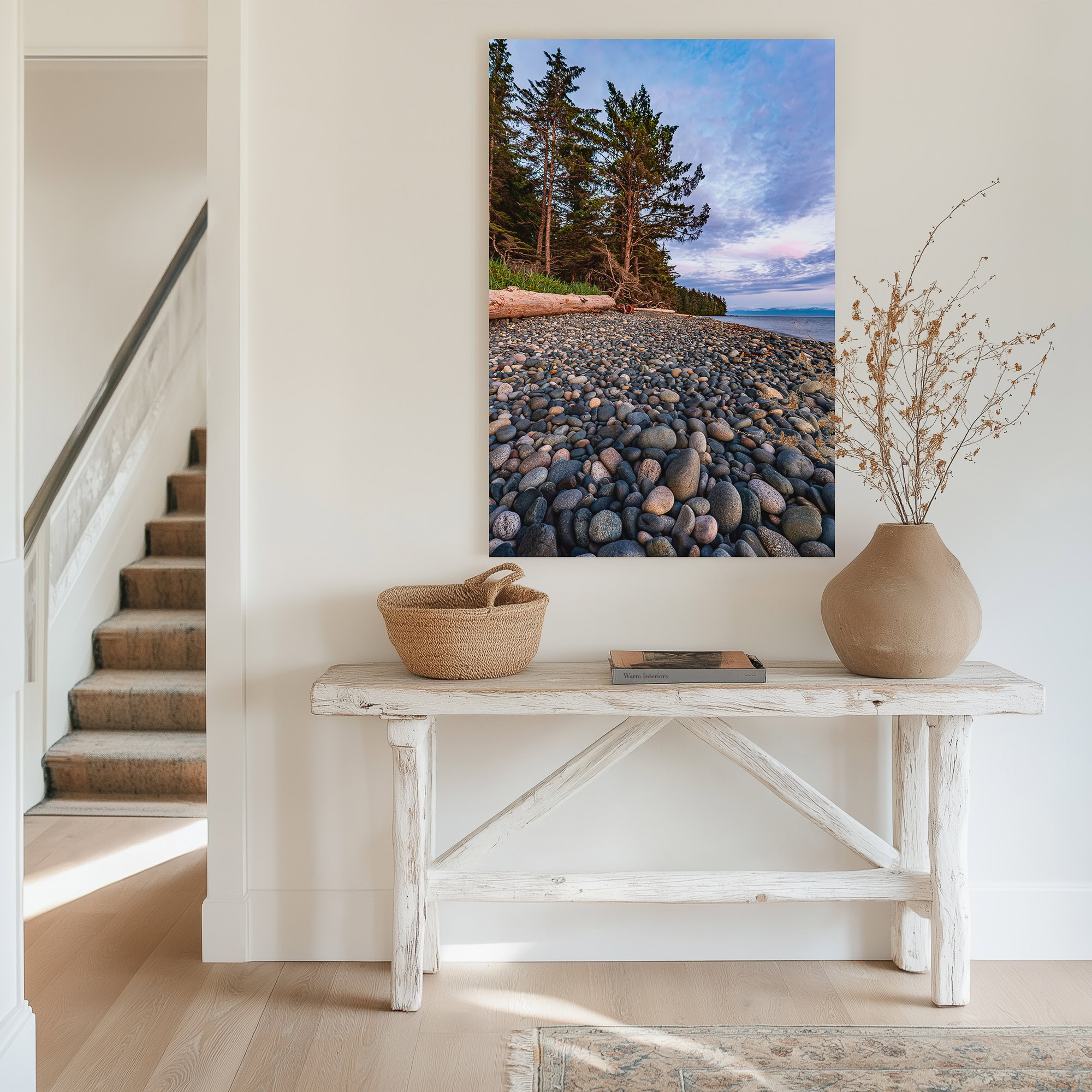 Evening Light on French Beach Stones print shown on the wall in an entryway.