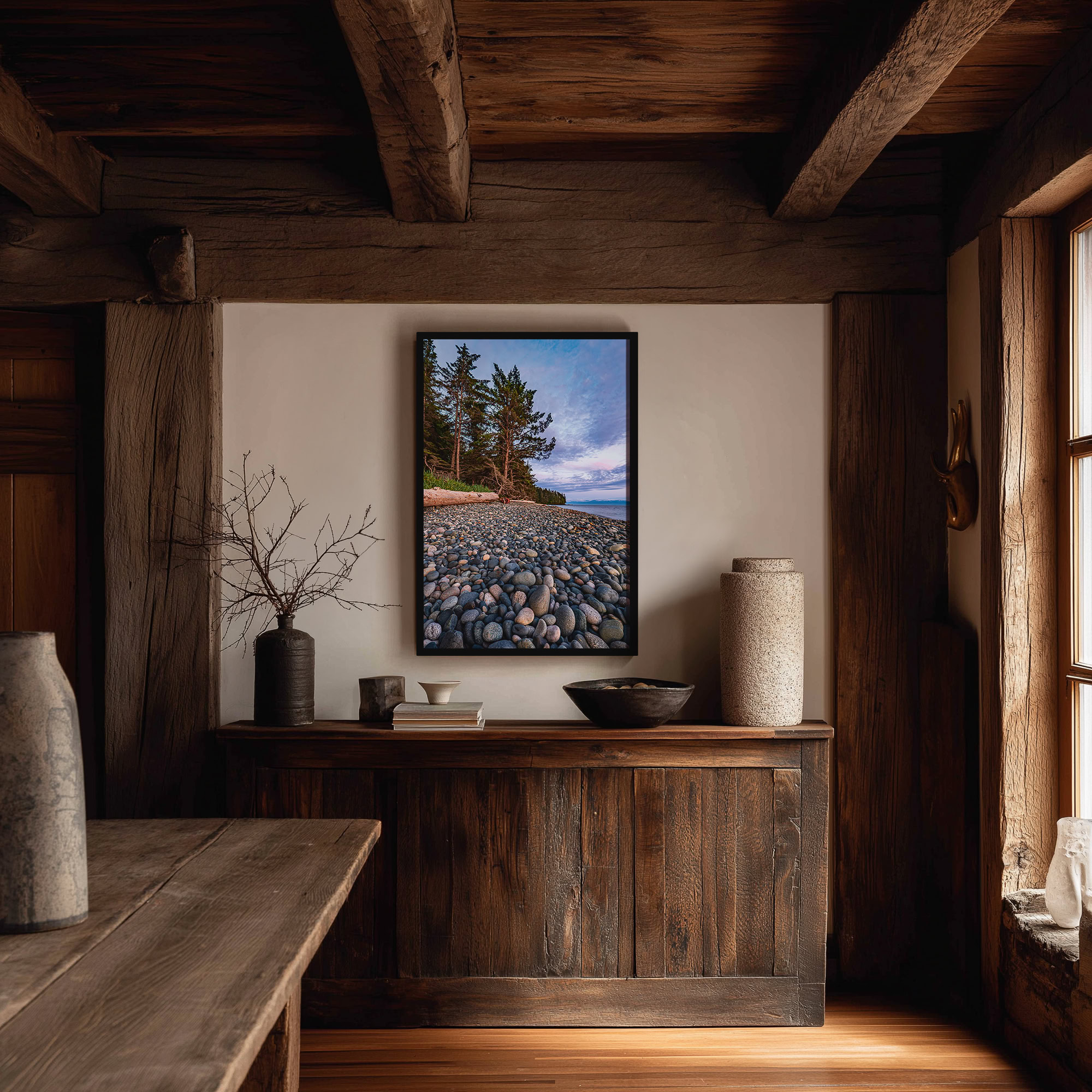 Evening Light on French Beach Stones print shown on the wall in a styled room.