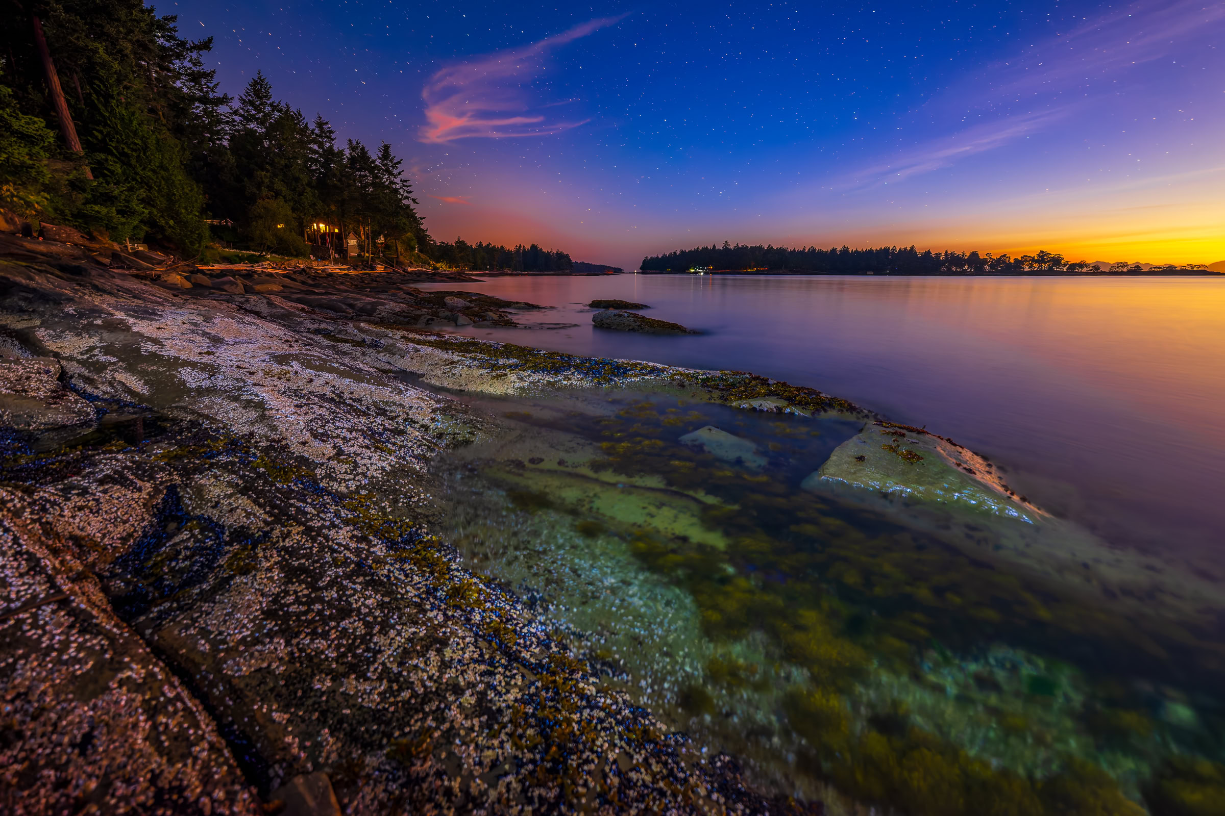 Galiano Island night sky wall art of mussel-covered shore rock and smooth water under the first stars at twilight, Sturdies Bay, BC, by James Wheeler.
