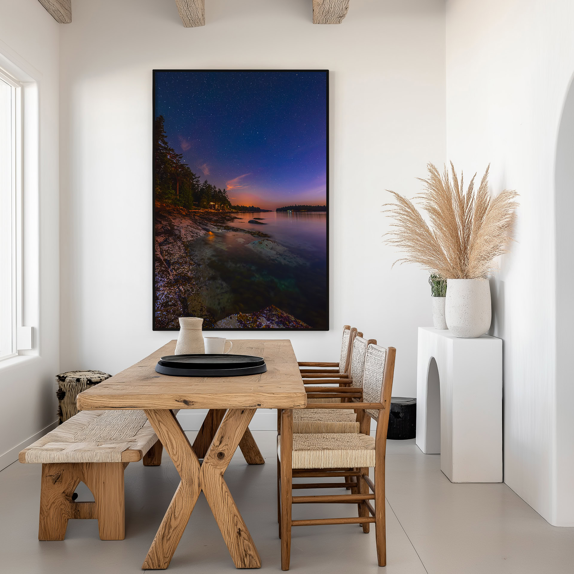 Galiano Island Shoreline Under the Stars print shown on the wall in a dining room.