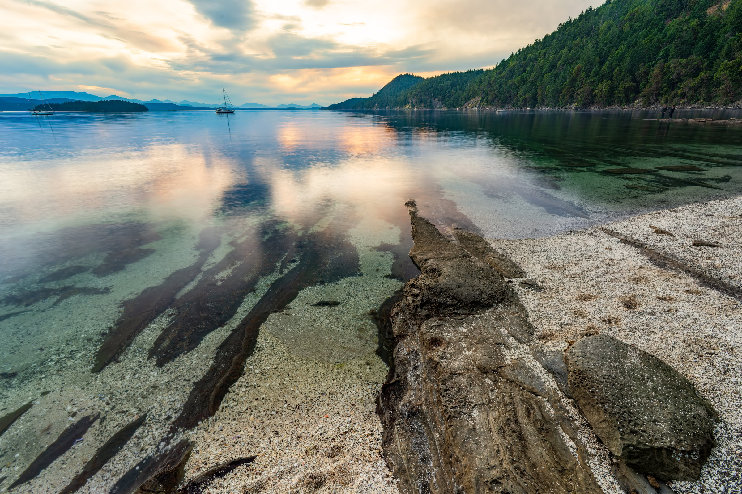 Galiano Island wall art of a white shell beach and sandstone ledge running into clear water at sunset in Montague Harbour, BC, by James Wheeler.