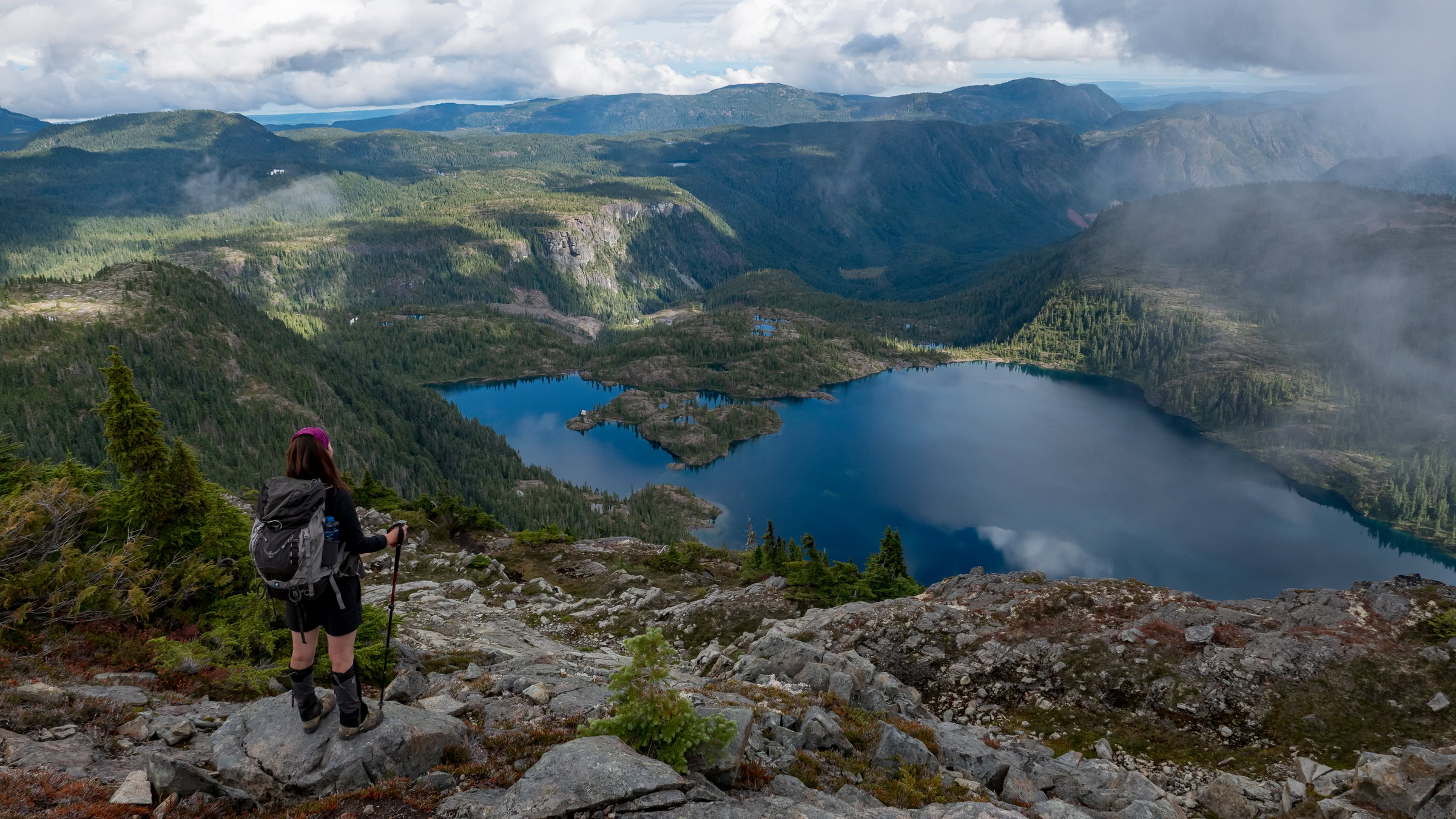 Woman looking at Moat Lake on Vancouver Island during Mount Albert Edward hike