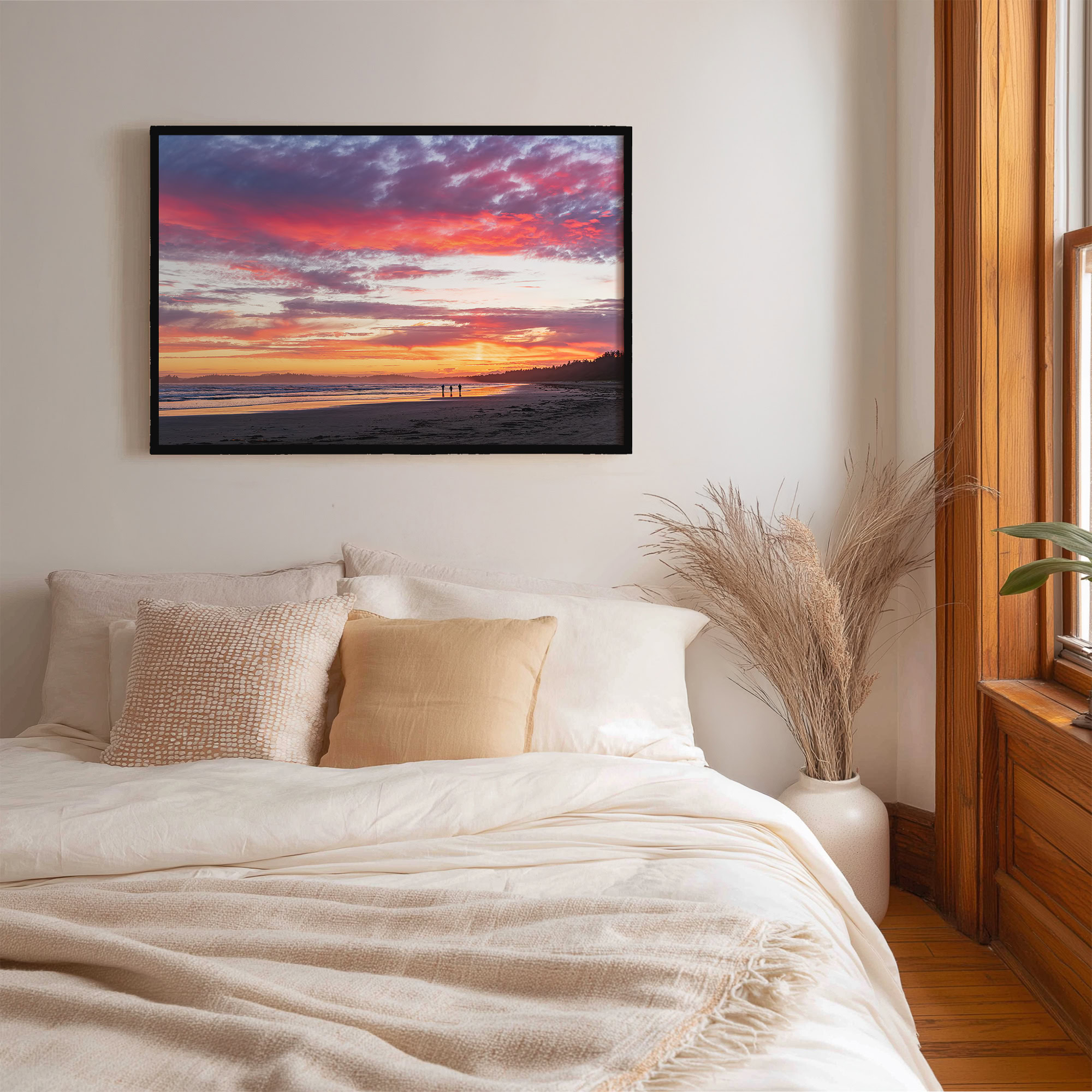 Pink Clouds Over Long Beach Tofino print shown on the wall in a bedroom.