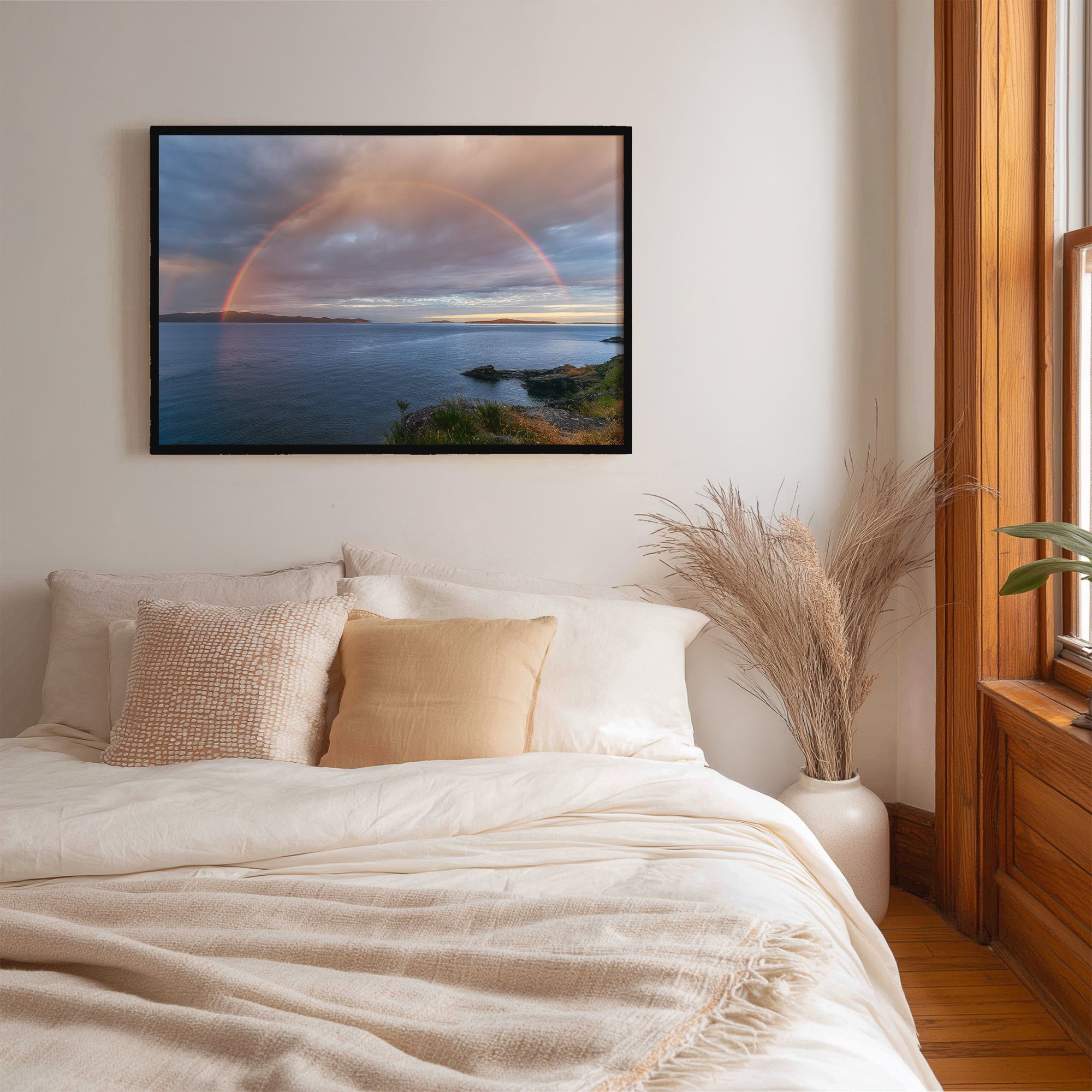 Salt Spring Island Full Rainbow print shown on the wall in a bedroom.