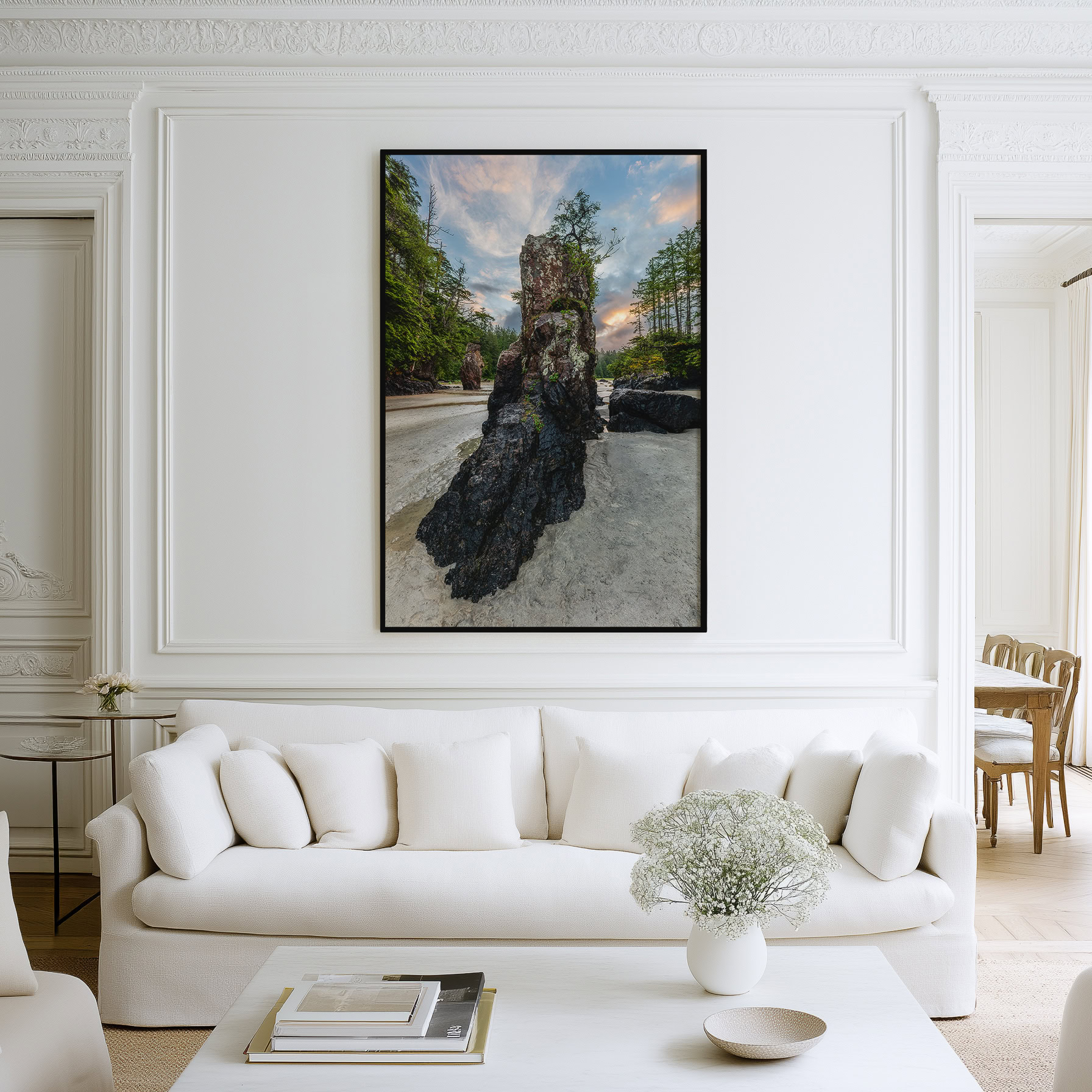 San Josef Bay Sea Stack at Sunrise print shown on the wall in a living room.