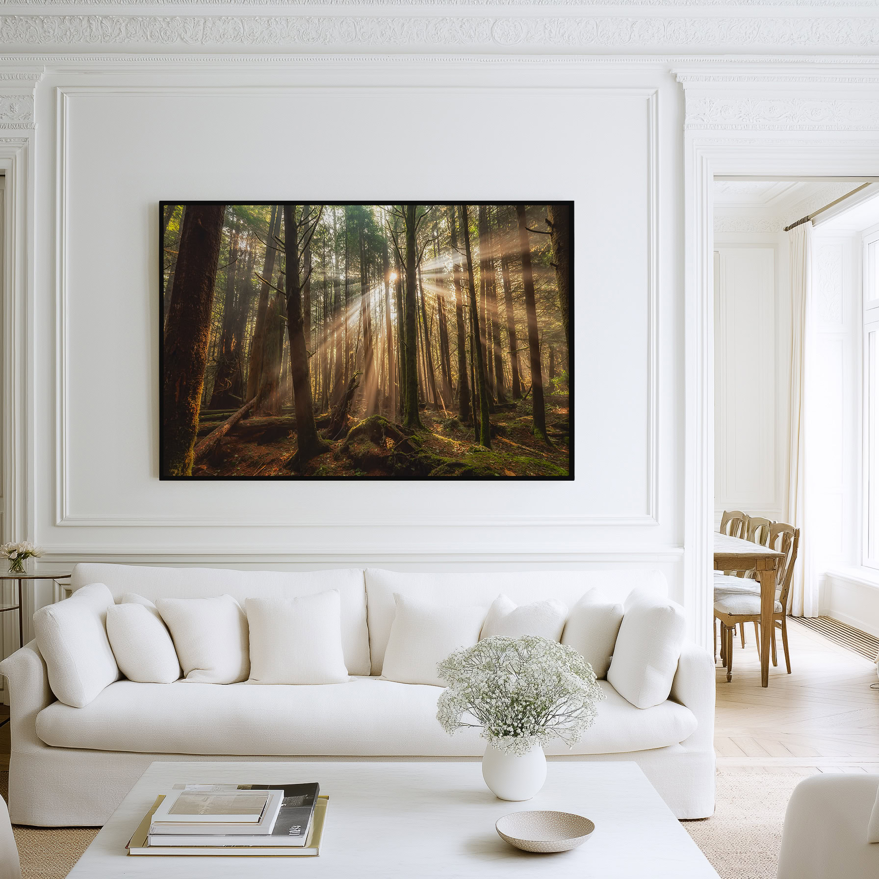 Tofino Rainforest Sunbeams in Morning Fog print shown on the wall in a living room.