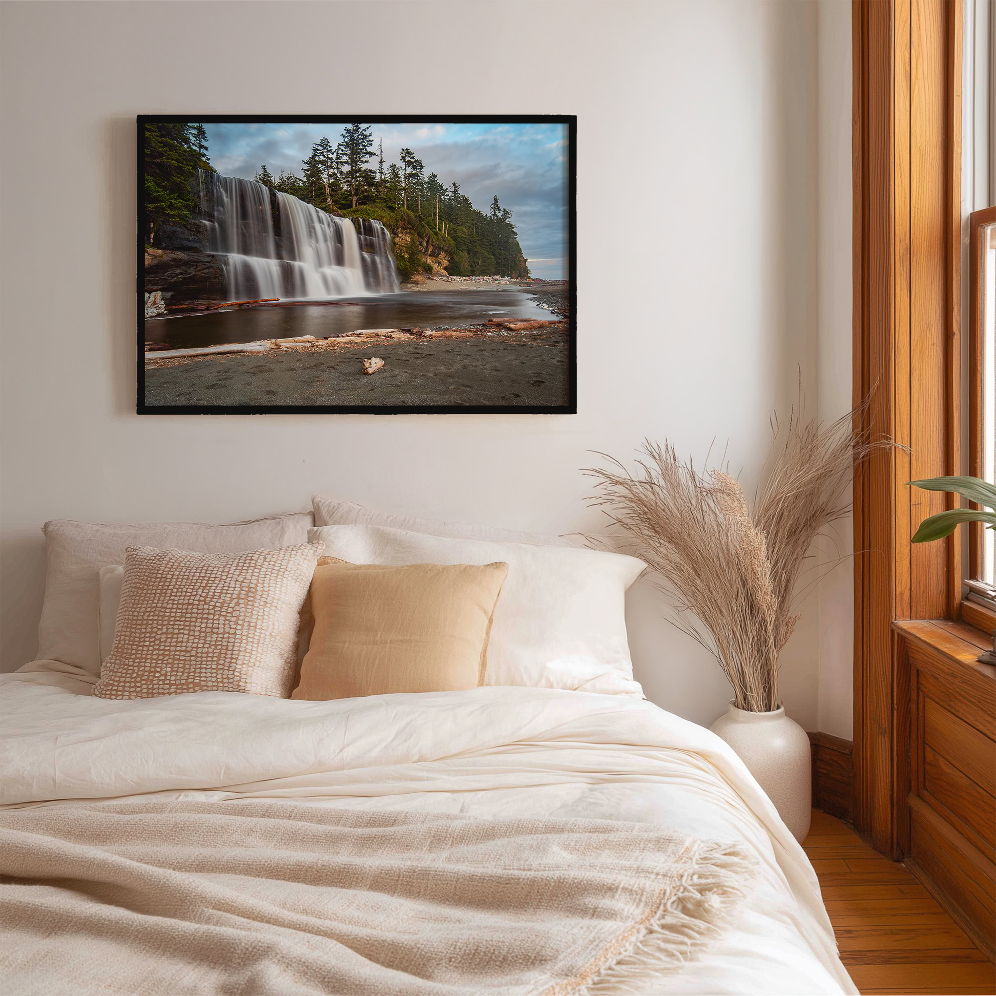 Tsusiat Falls on the West Coast Trail print shown on the wall in a bedroom.