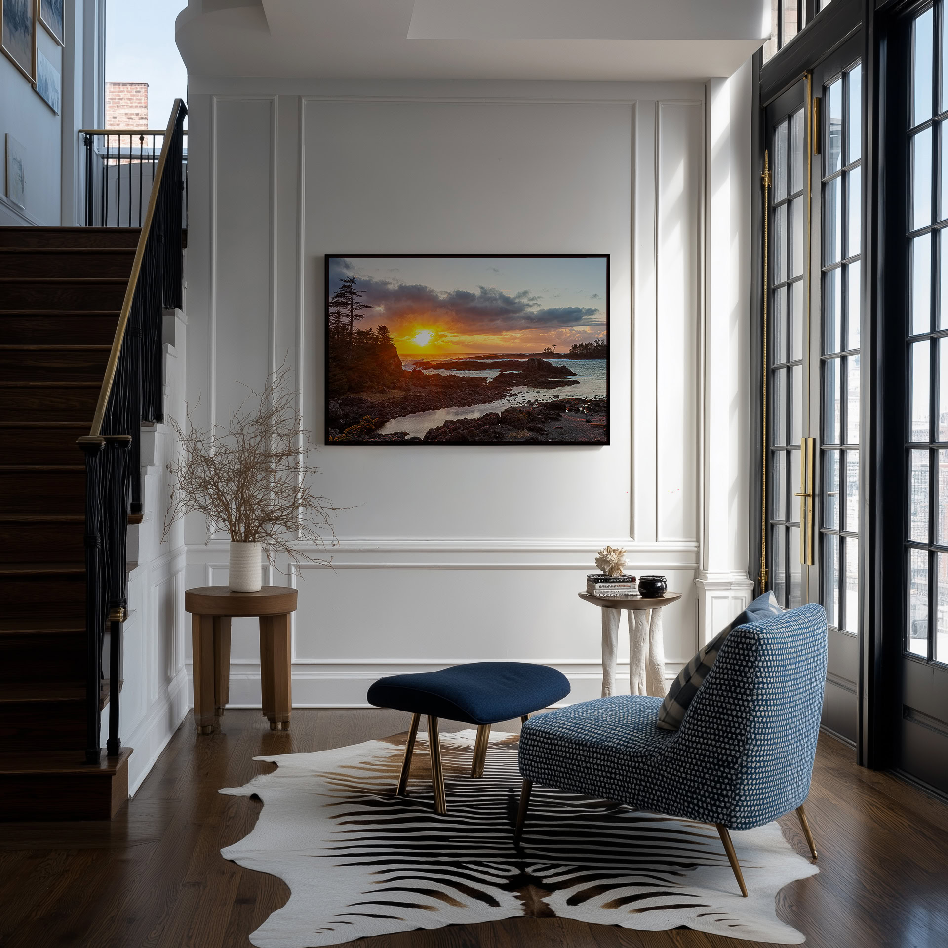 Ucluelet Sunset Through Breaking Clouds print shown on the wall in an entryway.