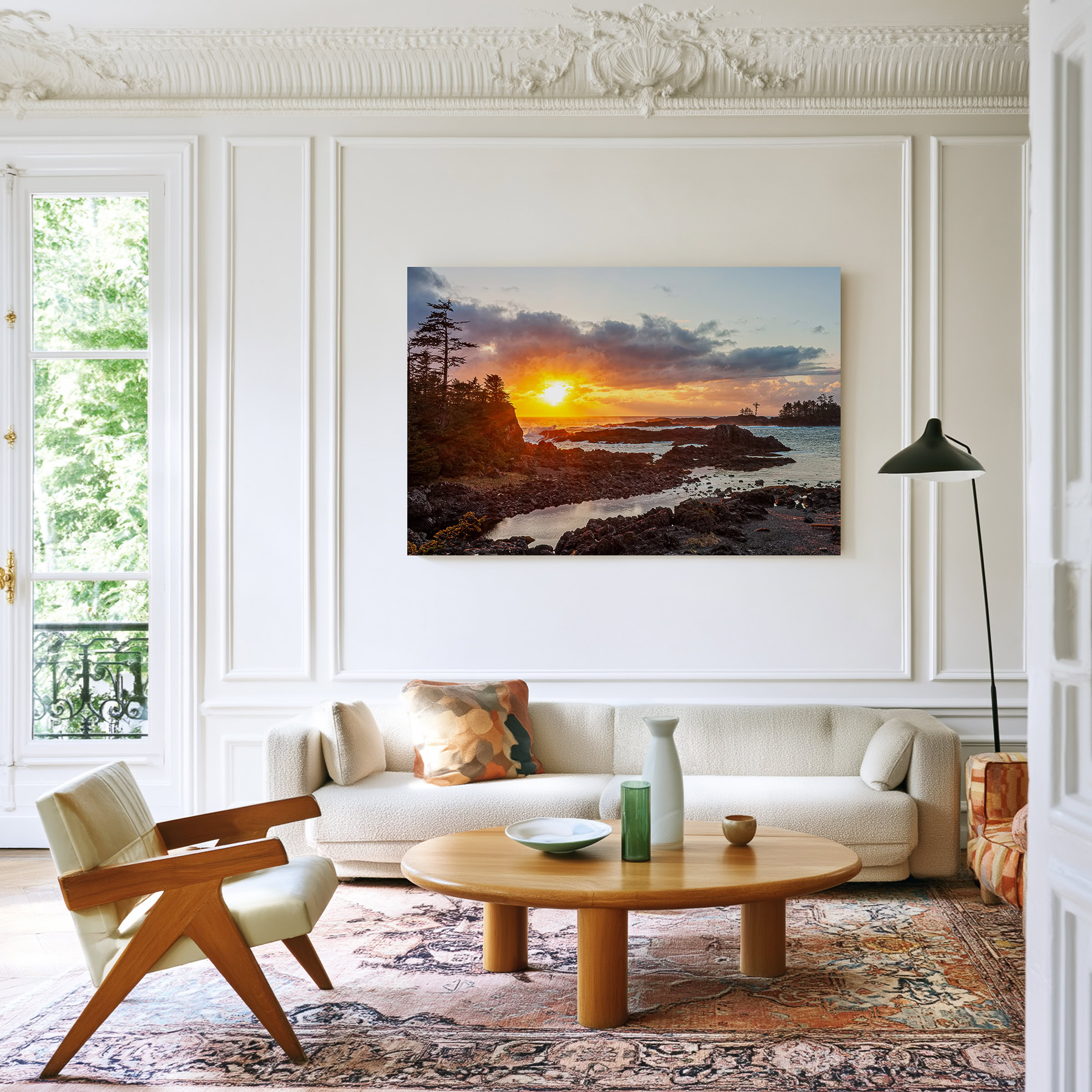 Ucluelet Sunset Through Breaking Clouds print shown on the wall in a living room.
